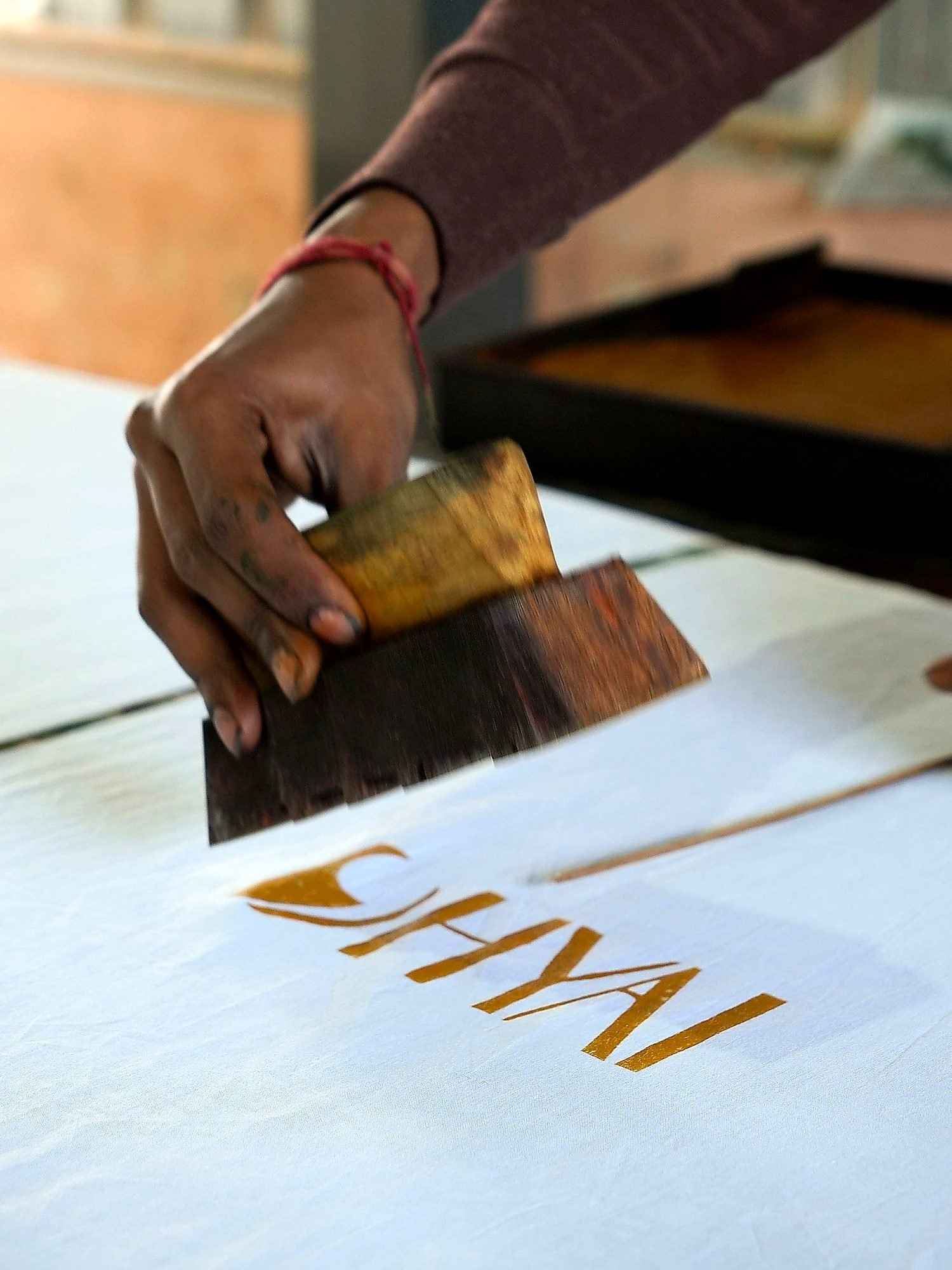 Hand block-printing in progress at the DHYAI studio